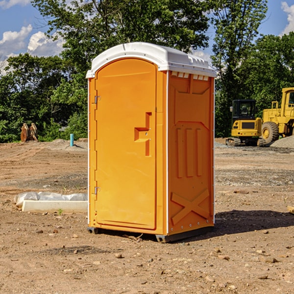 what is the cost difference between standard and deluxe portable restroom rentals in Grano